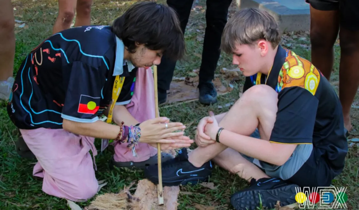 Yankunytjatjara student, Jack Tur-Martens (left) and Ngarrindjeri student, Joshua West, working together to light a fire at the Culture Night.