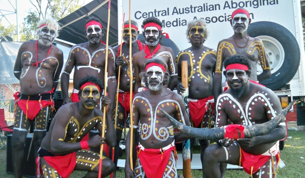 Image of a group of Indigenous men in traditional costume