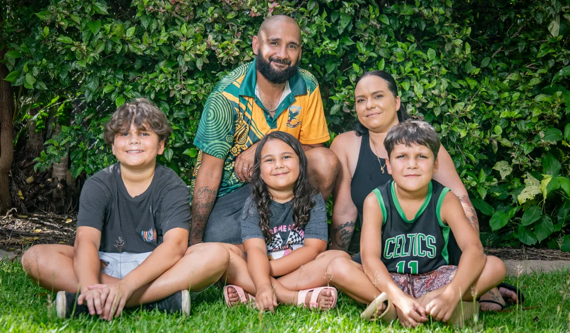 Sarah and Murray Liddle with their children at their new home in Darwin.