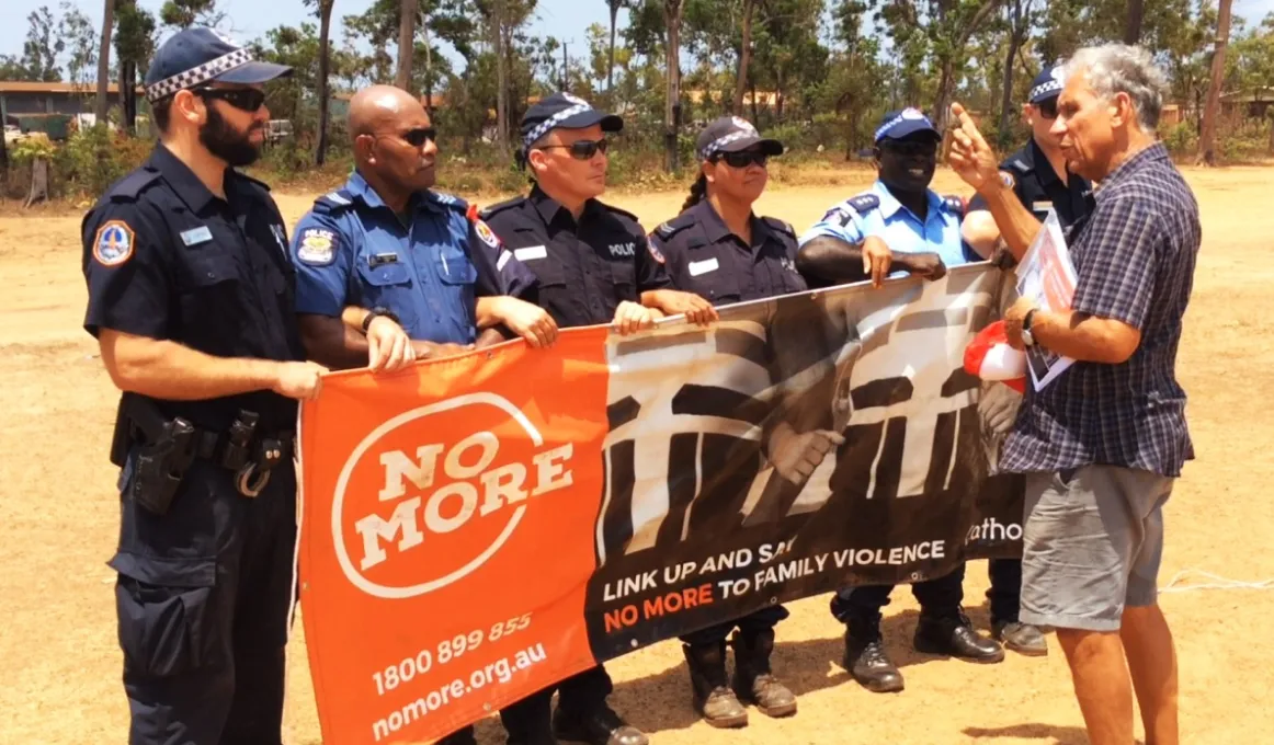 NO MORE campaign founder Charlie King with local police and visiting PNG police at the NO MORE launch in Ramingining