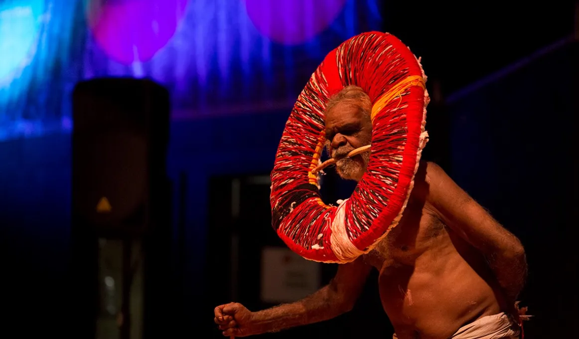 An elderly Aboriginal man performs a traditional dance at the Remote Indigenous Media Festival.