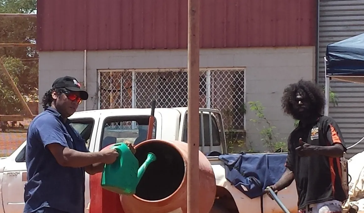 Milingimbi locals Robert Yurrkrrwuy and Jason Wanambi on the job at a construction site.