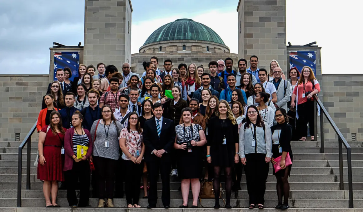 Participants in the WEX programme on the steps of the Australian War Memorial with Defence Minister Andrews.