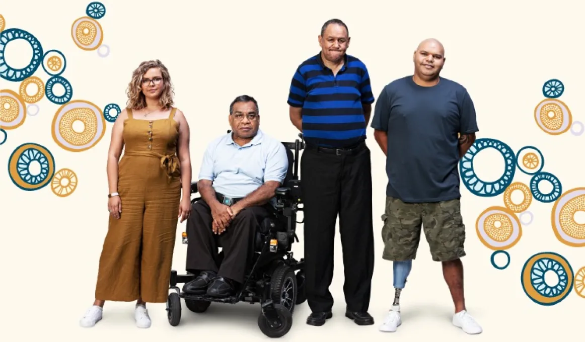 Three people stand while one sits in a wheelchair. The background is white with circles on it.