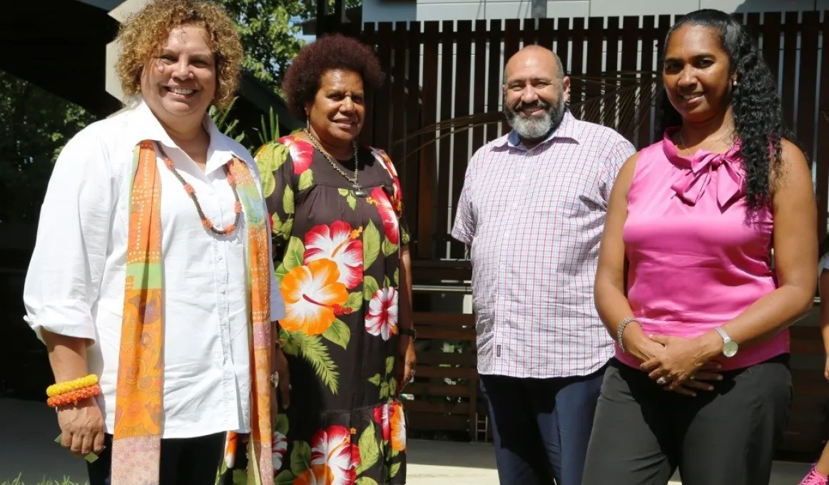 Three Indigenous women and one Indigenous man stand together outside, at the launch of the Torres Strait and Kaurareg Aboriginal Peoples’ Healing Strategy.