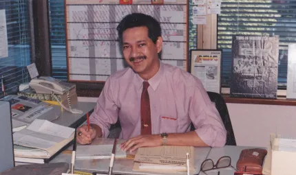 Ronald working at his desk