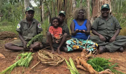 Working on Country winning photograph, by the Djelk Ranger group from Maningrida in central Arnhem Land, shows Traditional Owner Leila Nimbadja sharing conservation knowledge with the Djelk Women Rangers.