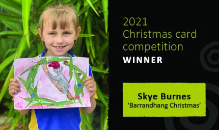 Skye Burnes holding her winning design titled ‘Barrandhang Christmas’.