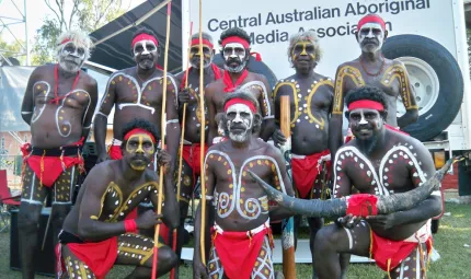 Image of a group of Indigenous men in traditional costume