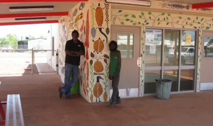 Beswick artists Peter Lindsay and Bruce Hall in front of a mural they created for Beswick’s new store