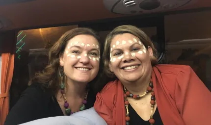 Beth Hall (left) and Dorinda Cox (right) celebrating as part of the APEC Women and the Economy forum’s cultural exchange.