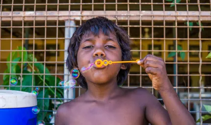 Child blowing bubbles