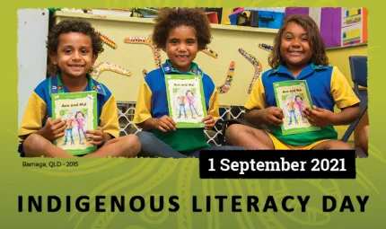 Photograph of three children in school uniforms holding a book and smiling. Text reads Indigenous Literacy Day, 1 September 2021