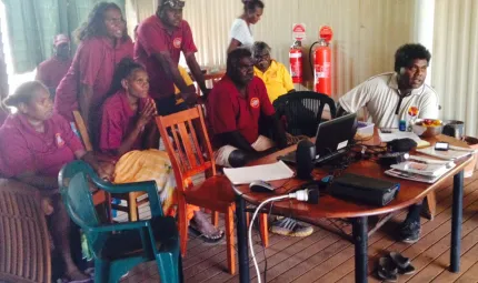 A photo of a group of school attendance officers in a room