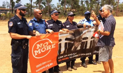 NO MORE campaign founder Charlie King with local police and visiting PNG police at the NO MORE launch in Ramingining