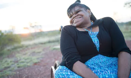 Indigenous woman sitting in a wheel chair.