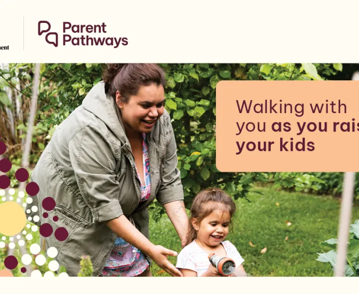 A lady helps a child move along