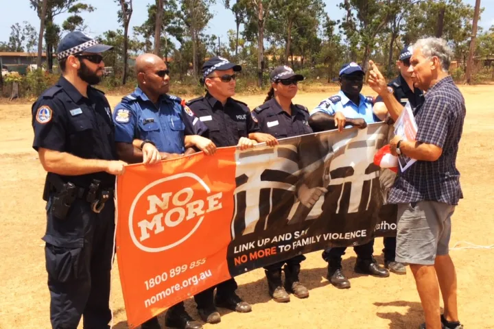 NO MORE campaign founder Charlie King with local police and visiting PNG police at the NO MORE launch in Ramingining