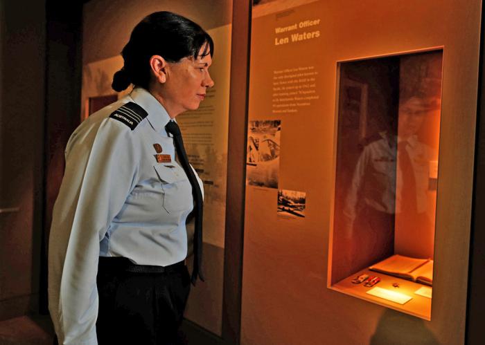 Wing Commander Cheryl Neal viewing the collection at the Australian War Memorial.