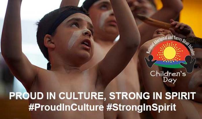 Group of Indigenous Children holding traditional objects. Children have face paint and headbands on. Image includes the following text: PROUD IN CULTURE, STRONG IN SPIRIT #ProudInCulture #StrongInSpirit 