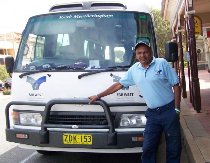 Terry Doolan standing in front of his bus.