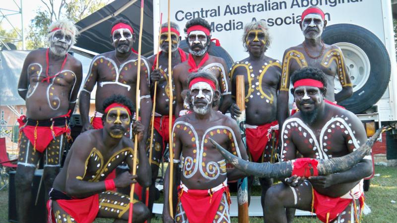 Image of a group of Indigenous men in traditional costume