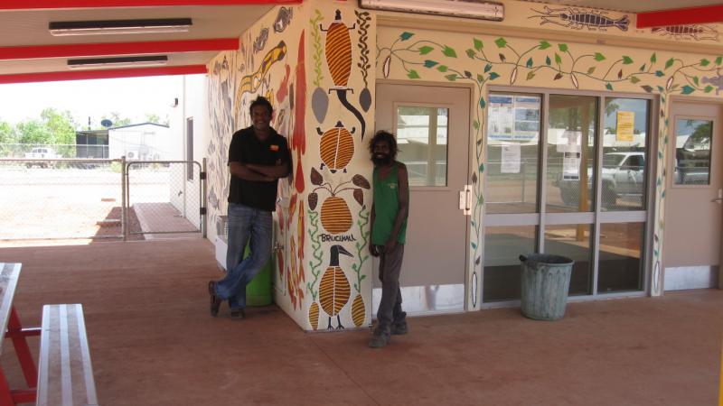 Beswick artists Peter Lindsay and Bruce Hall in front of a mural they created for Beswick’s new store