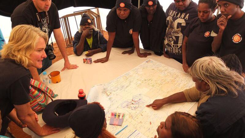 KJ and Birriliburru Women Rangers working together to map areas where Bilbies are located.