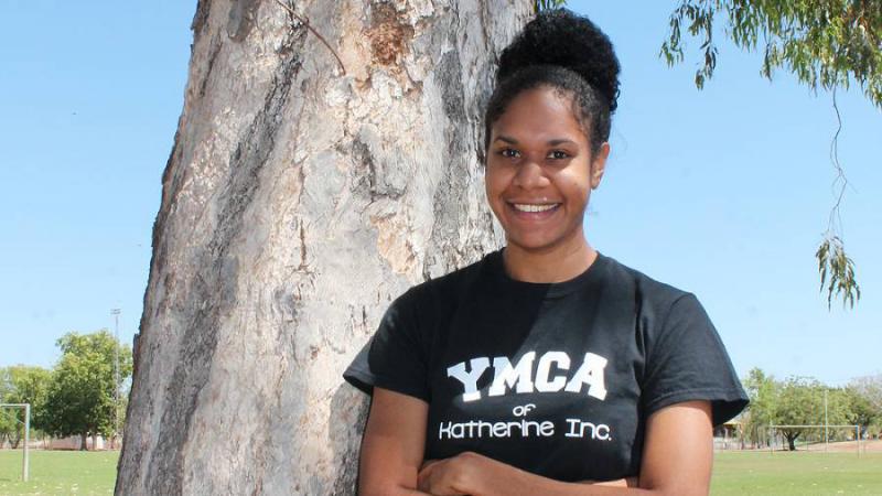 Chantal Ober standing next to tree wearing a YMCA t-shirt