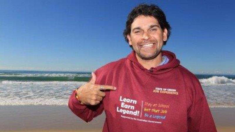 David Peachey standing on the beach.