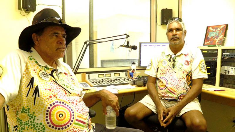 Two Indigenous men in a radio studio.