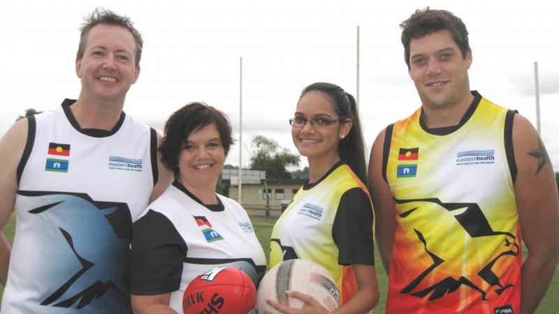 Barry Collins, Jo Voce, Marisa Smiler-Cairns and Jie Smith dressed in sporting uniforms.