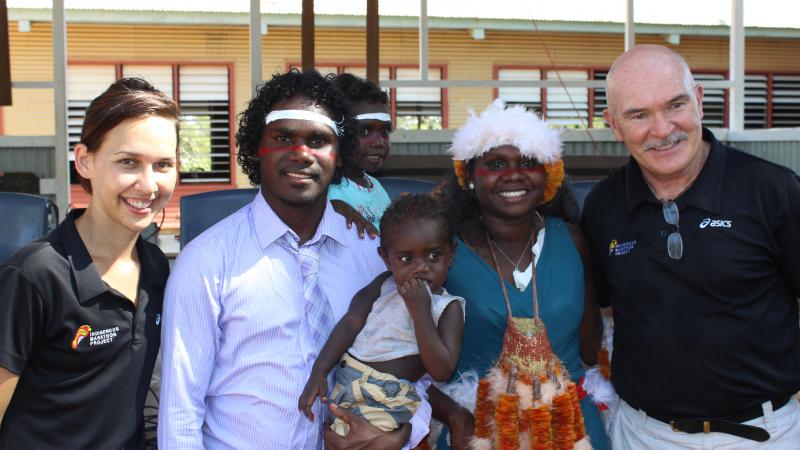 Evelyna Dhamarrandji (second from right), her partner Tyrese Dhurrkay (second from left) and their children, with the Indigenous Marathon Project’s Nadine Hunt and Robert de Castella. 