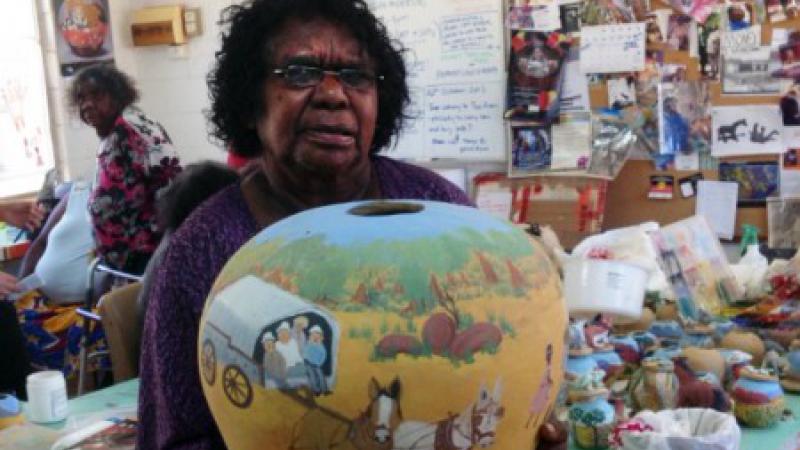 Judith Inkamala displays her latest work of pottery.  