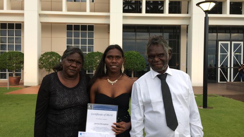 Jericka Mungatopi proudly showing off her award with parents Katrina and Fredrick.