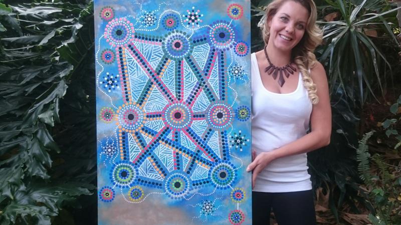 Lani Balzan with her artwork 'Songlines tie all Aboriginal people together'