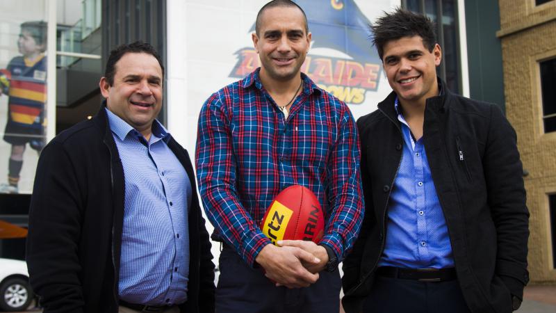 Crows legend Andrew McLeod flanked by new Project Officers, inaugural Crows team member Eddie Hocking (left) and Crow’s SANFL player, Josh Wittwer