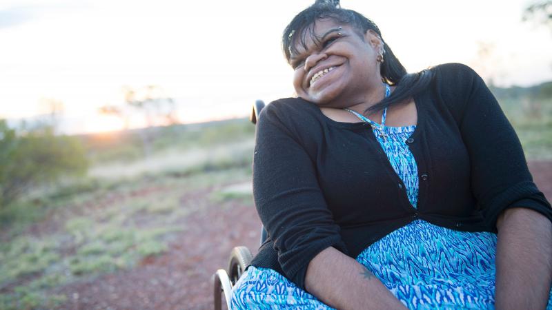 Indigenous woman sitting in a wheel chair.