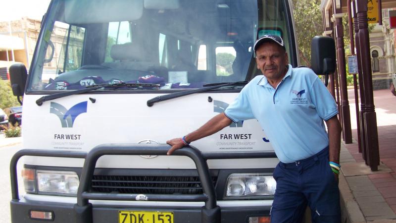 Terry Doolan standing in front of his bus.