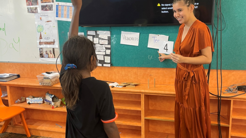 First year primary school teacher Tayha Duggan-Hill with students in Maningrida, NT