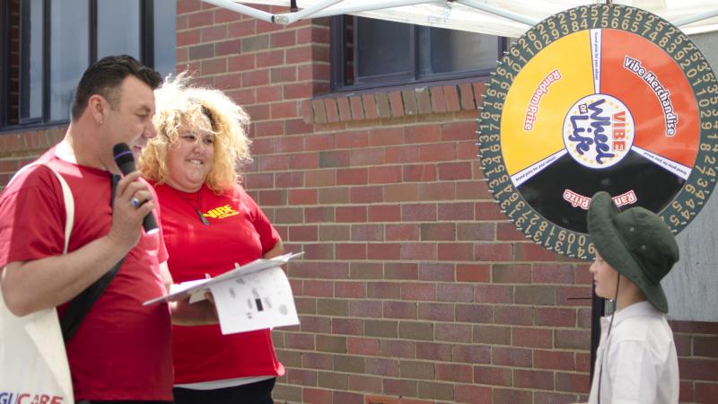 Vibe CEO Gavin Jones and singer Casey Donovan running the Wheel of Life, a trivia game about health and Indigenous culture, Goulburn, NSW.