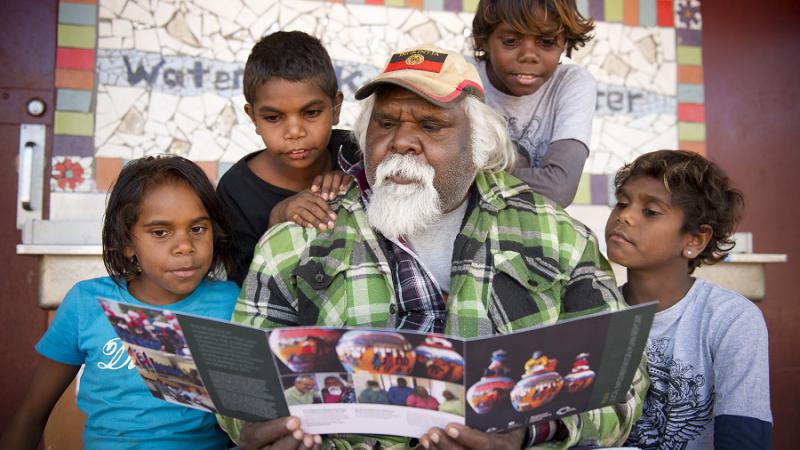 Hermannsburg Indigenous Engagement Officer, Edward Rontji with Ntaria school kids Mahalia Moketarinja, Bowen Abbott, Johannas Kantawara & Ashley Lankin