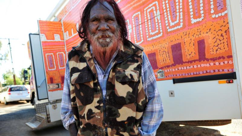 “Purple Truck” artist Patrick Tjungarryi with the truck