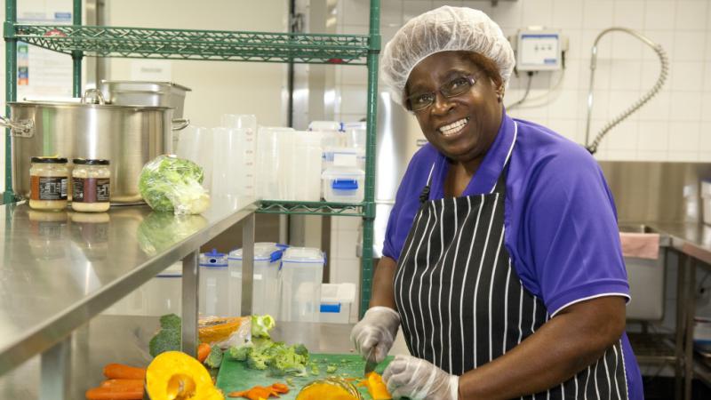 Hellen Jans preparing a healthy meal at the Mookai Rosie Bi-Bayan Child and Maternal Health Care Centre, Edmonton, near Cairns, QLD.