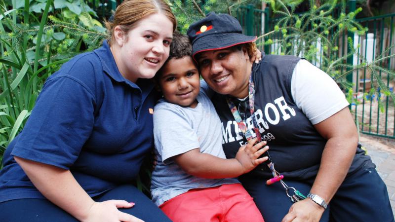 SDN Redfern Koori workers Kayeleigh Smith (left) and Judy Jarrett (right) with Judy’s grandson Manduman, who is enrolled in the SDN preschool program.