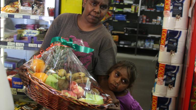 Lorraine Stuart and her daughter Samantha with the fruit basket they won in one of Aputula Community Store’s weekly draws.