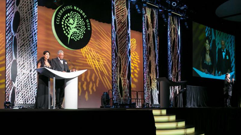 Picture of the 2013 National NAIDOC Award MCs, Nerelda Jacobs and Ernie Dingo, on stage at the National NAIDOC Awards in Perth last week.