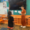 First year primary school teacher Tayha Duggan-Hill with students in Maningrida, NT