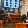 First year primary school teacher Tayha Duggan-Hill with students in Maningrida, NT