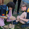 Yankunytjatjara student, Jack Tur-Martens (left) and Ngarrindjeri student, Joshua West, working together to light a fire at the Culture Night.